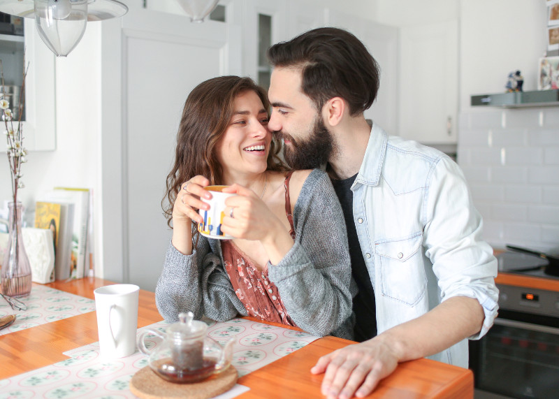 couple hugging in kitchen