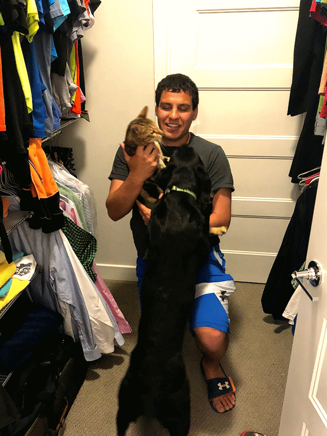 pets hugging owner in closet
