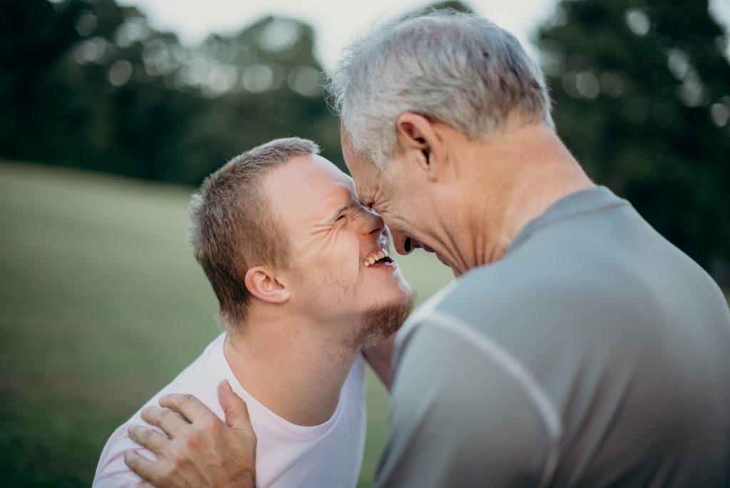 father and son touch foreheads