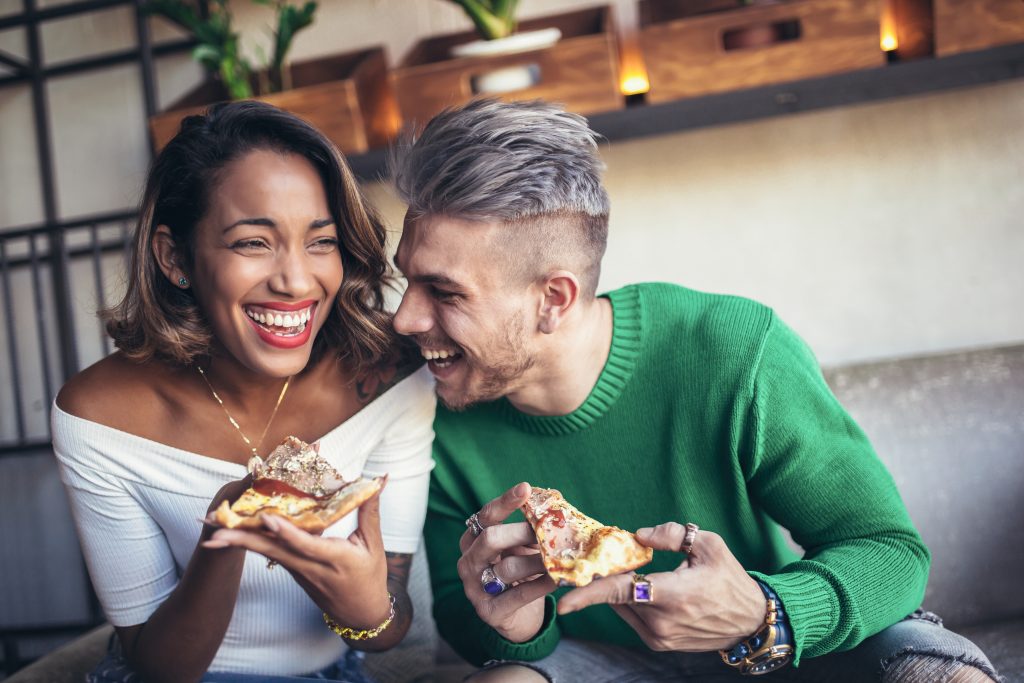 couple eats pizza