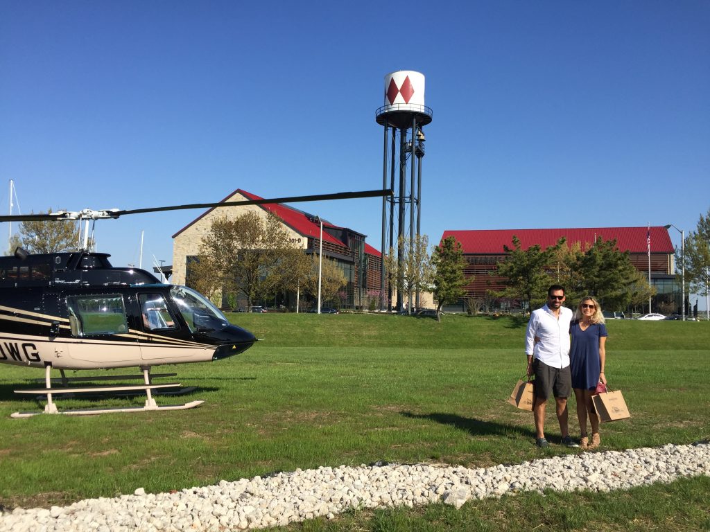 couple next to helicopter